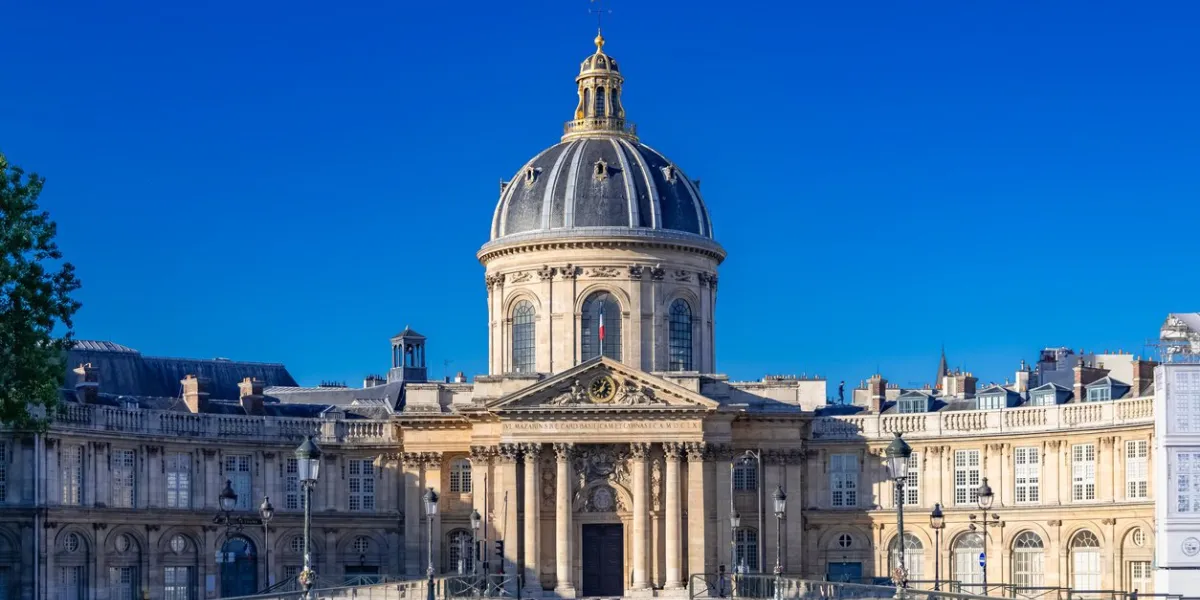 paris, france, may 6th, 2019, the pont des arts on the seine, and the institut de france, beautiful monument