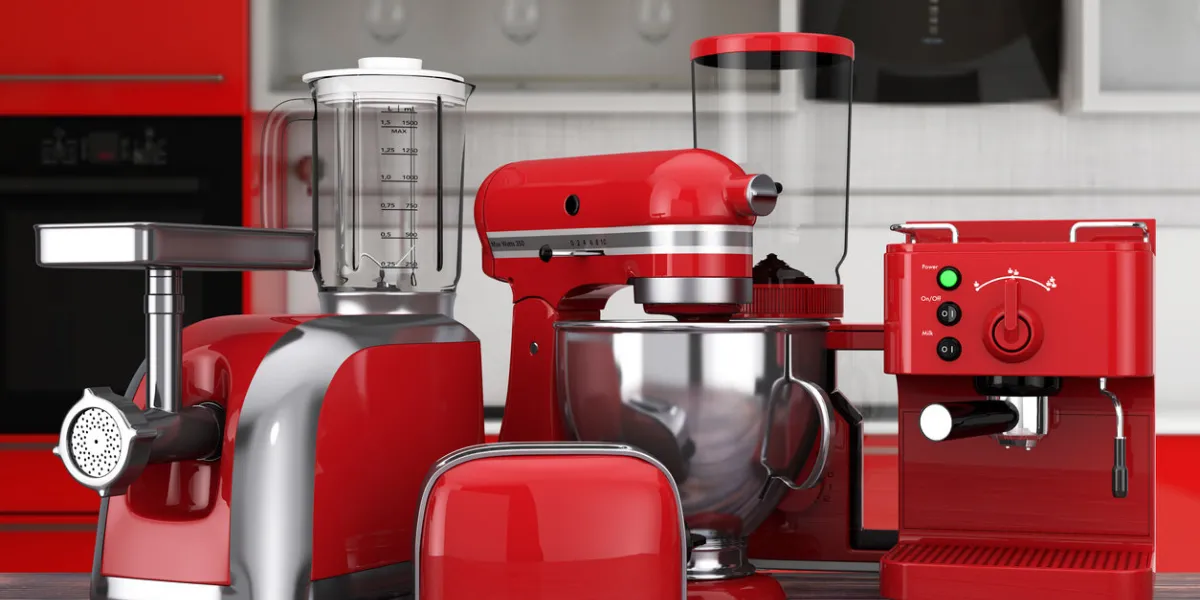 kitchen appliances set red blender, toaster, coffee machine, meat ginder, food mixer and coffee grinder on a wooden table 3d rendering