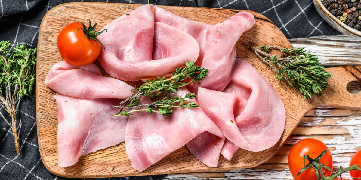 sliced ham fresh prosciutto pork ham sliced white wooden background top view