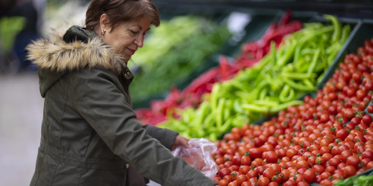 mature woman shopping in a grocery store