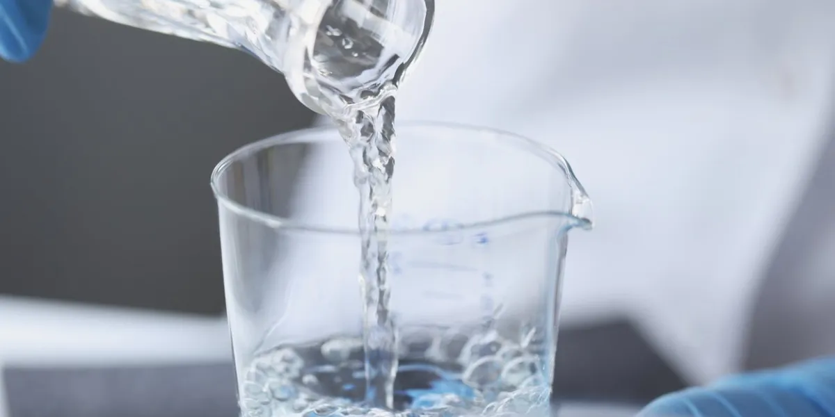 scientist examines drinking water in laboratory presence of nitrates in water exceeding norm concept