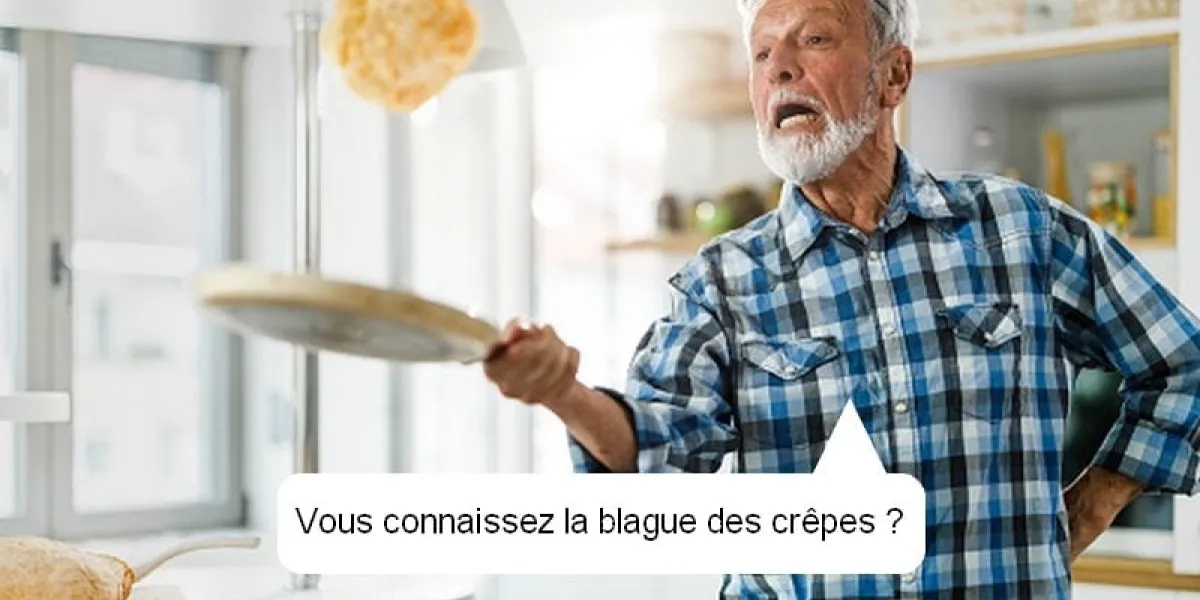 mature man having fun while frying and throwing pancakes in the kitchen
