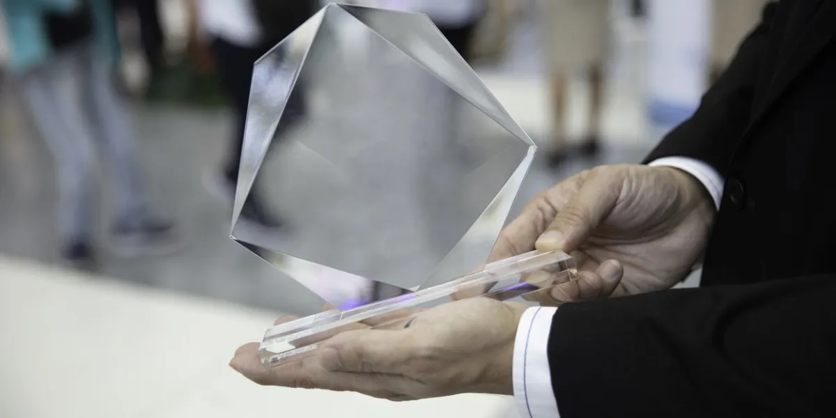 hand man holding award, successful achievement concept