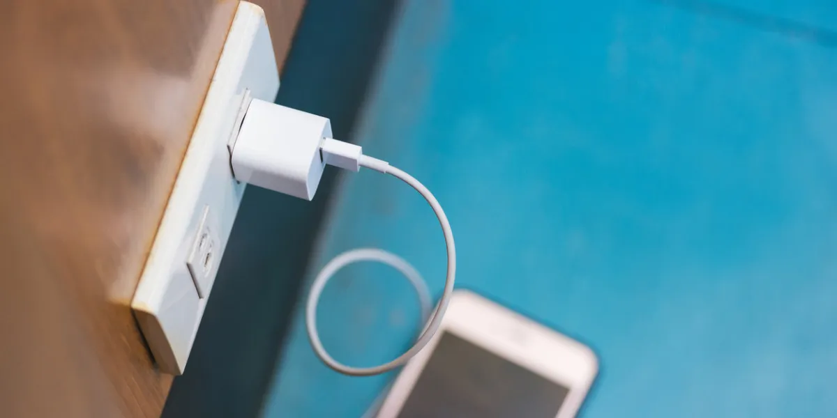 changing smart phone in public place and smart phone place on the blue floor in selective focus