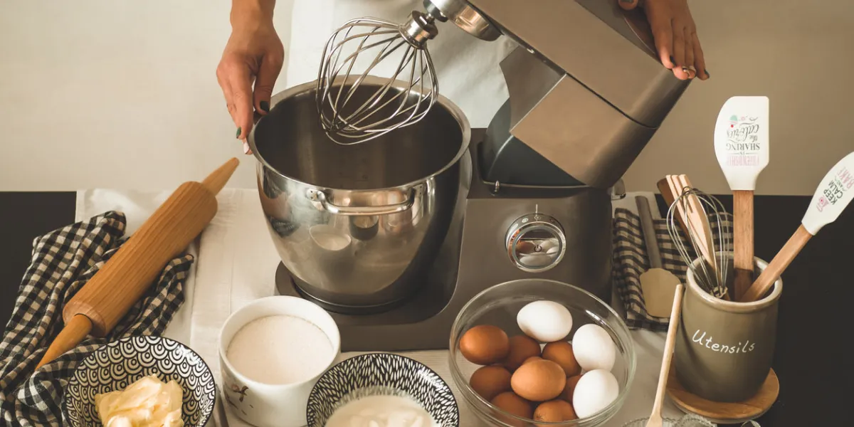 confectioner girl is preparing a cake concept ingredients for cooking flour products or dessert rural or rustic style