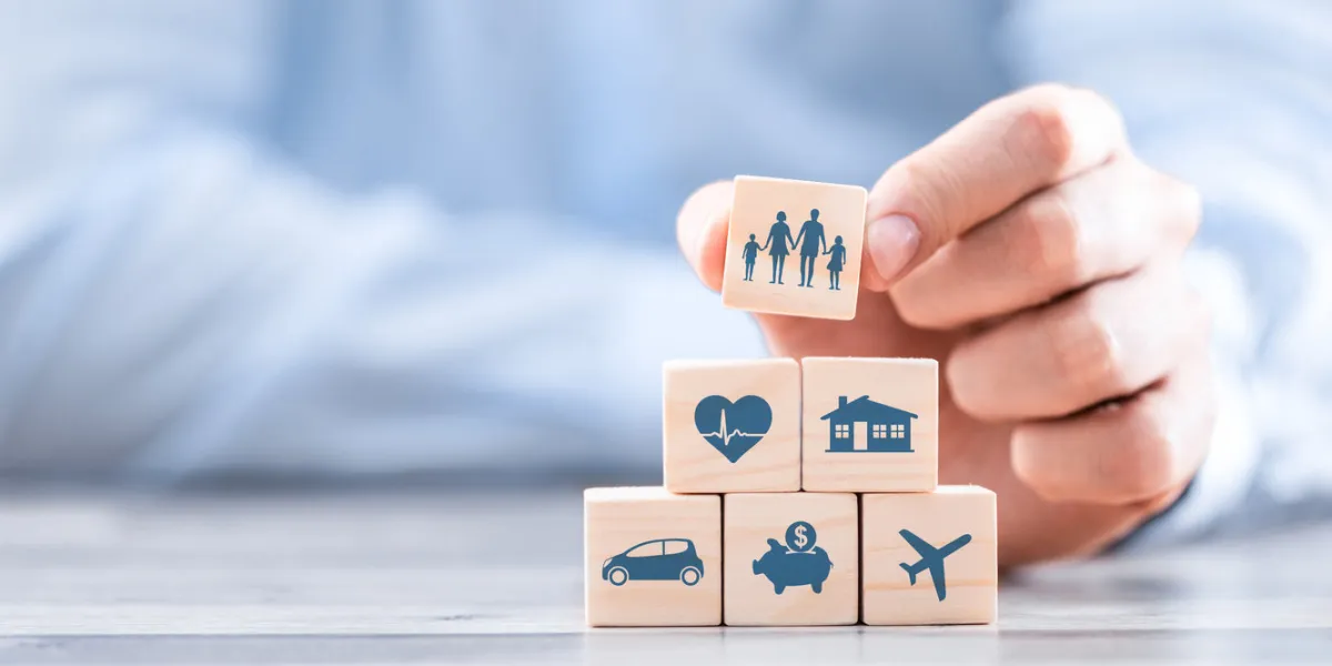 wooden blocks with icons of various types of insurance life insurance concept