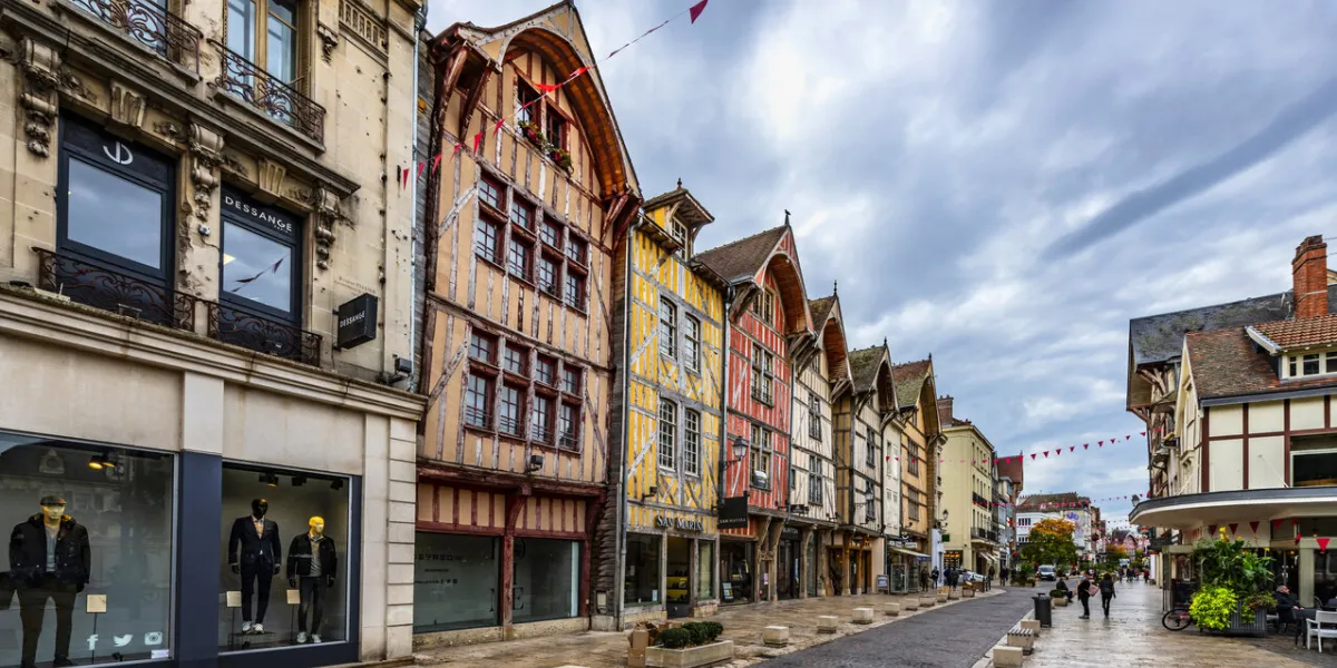 troyes, france, october 22, 2020  view of a street with old half timbered houses in the historic district of this french town under cloudy autumn sky