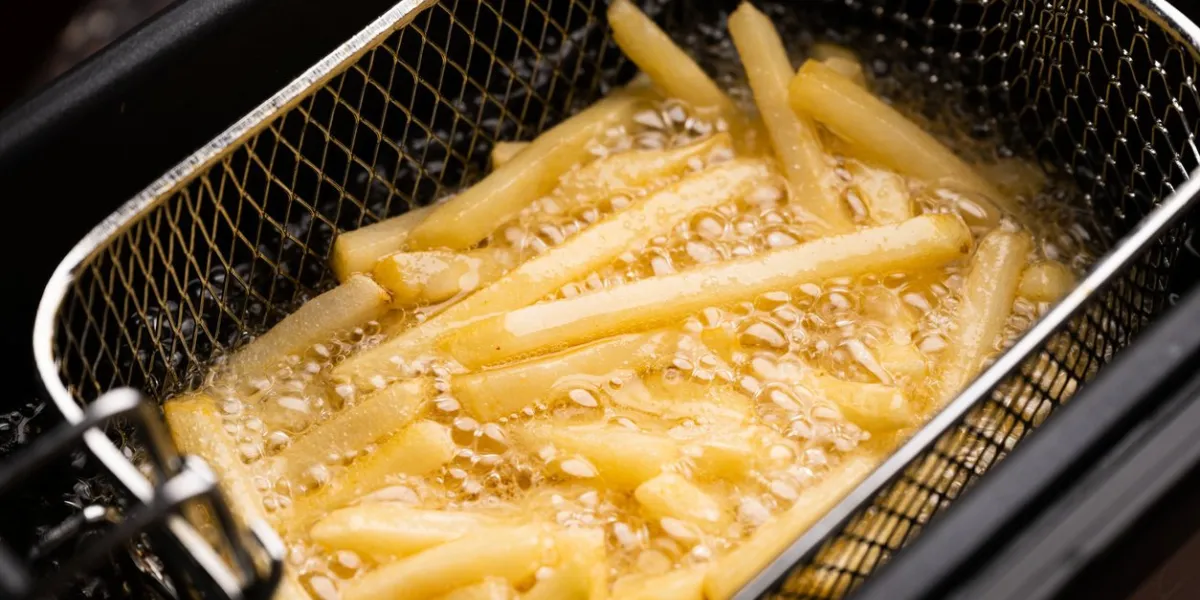 friing potatos in fryier for french fries