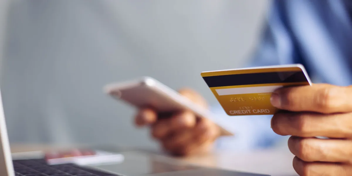 online payment hands holding credit card and using laptop online shopping concept