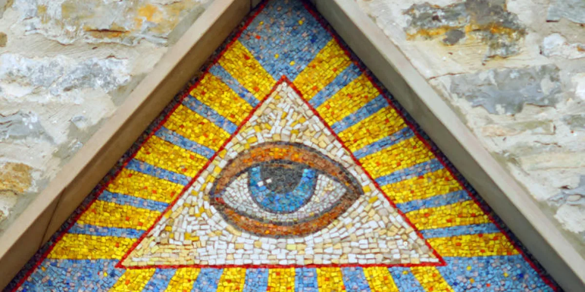 all-seeing eye of god - a mosaic of wall background medieval church eye of providence - famous symbol of masons and illuminati