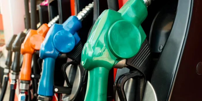 petrol pump filling fuel nozzle in gas station fuel dispenser machine refuel fill up with petrol gasoline petrol industry and service red petrol fuel nozzle petroleum oil industry oil crisis