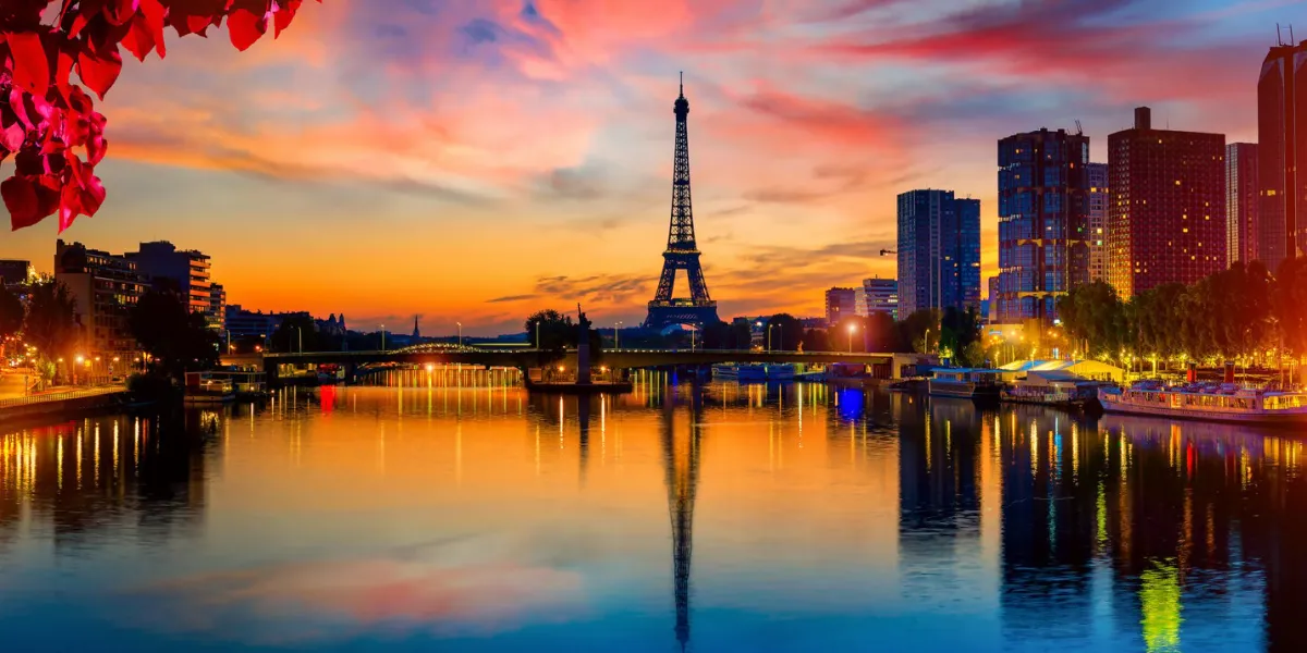 view on eiffel tower and skyscrapers on seine in paris at night, france