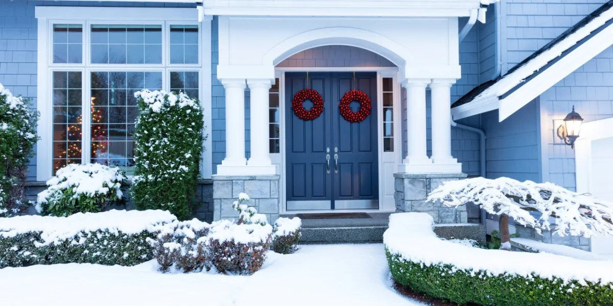 walkway to a fresh blanket of snow on residential home during the winter holidays