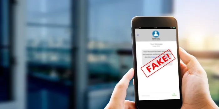 fake text message sms scam or phishing concept