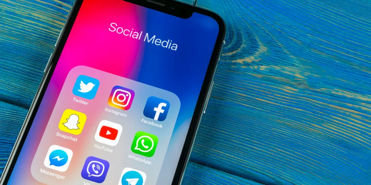 sankt-petersburg russia april 5, 2018  apple iphone x on office desk with icons of social media facebook, instagram, twitter, snapchat application on screen social network starting social media app photo taken at company office