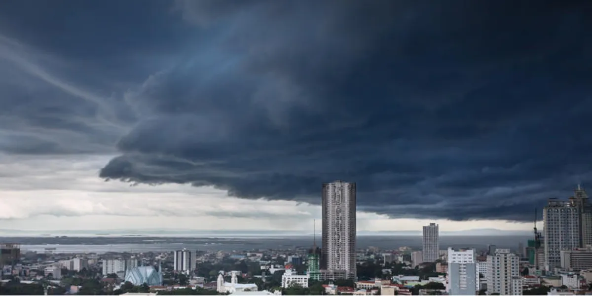heavy storm rainy clouds over modern city