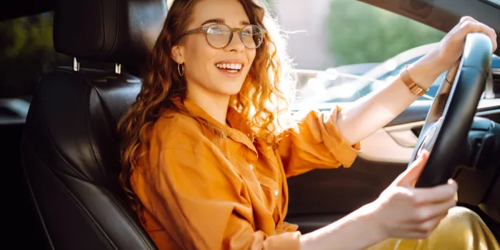 stylish woman driving a car the traveler is the driver automobile travel sharing a car lifestyle concept