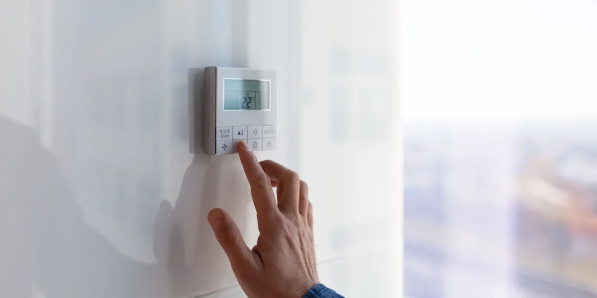 the air conditioning and heating control panel for the apartment and office is located on a white wall