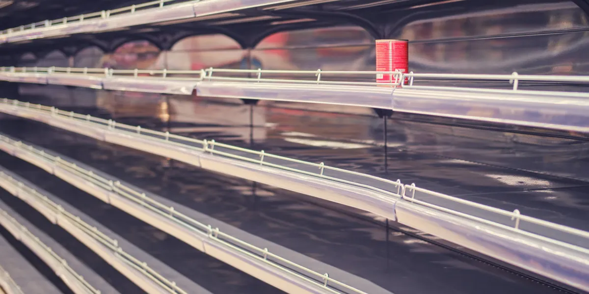 store shelves without canned food during a rush of demand due to coronavirus