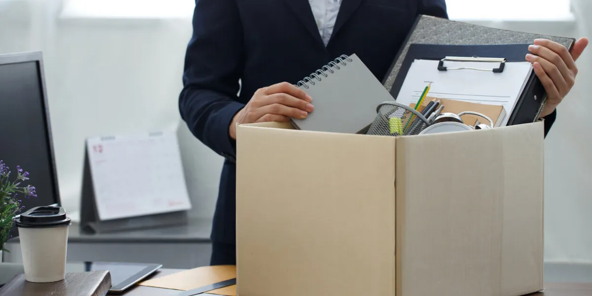 resignation conceptbusinesswoman packing personal company belongings when she deciding resignation change of job or fired from the company