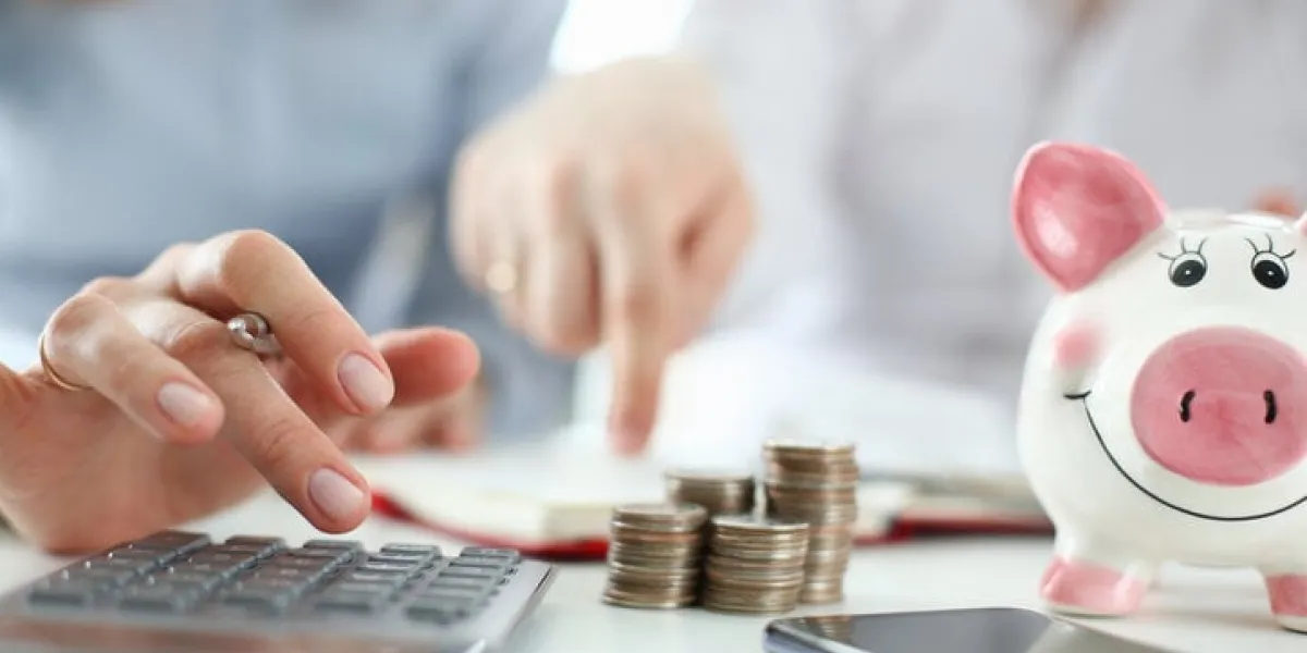 man and woman hand consider on calculator expenses of family budget aganist home background lending purchase rental housing mortgage concept