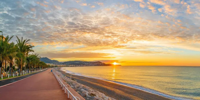 landscape with colorful sunrise panorama over the bay of angels, nice, french riviera coast