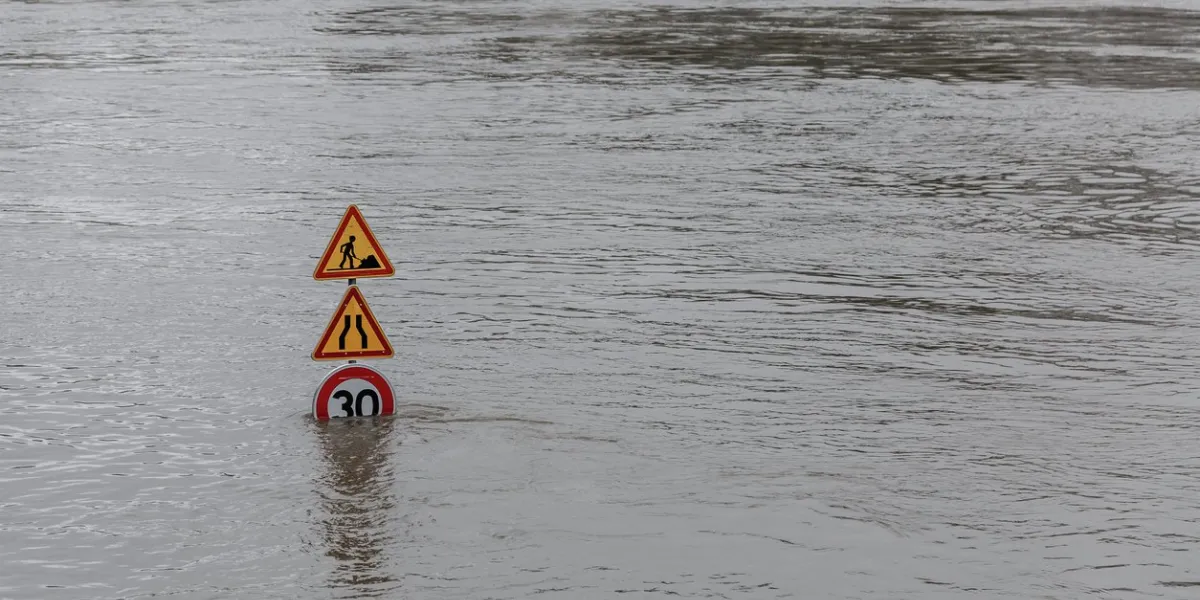 flood in paris, extremely high water on the river seine, road signs covered with water june