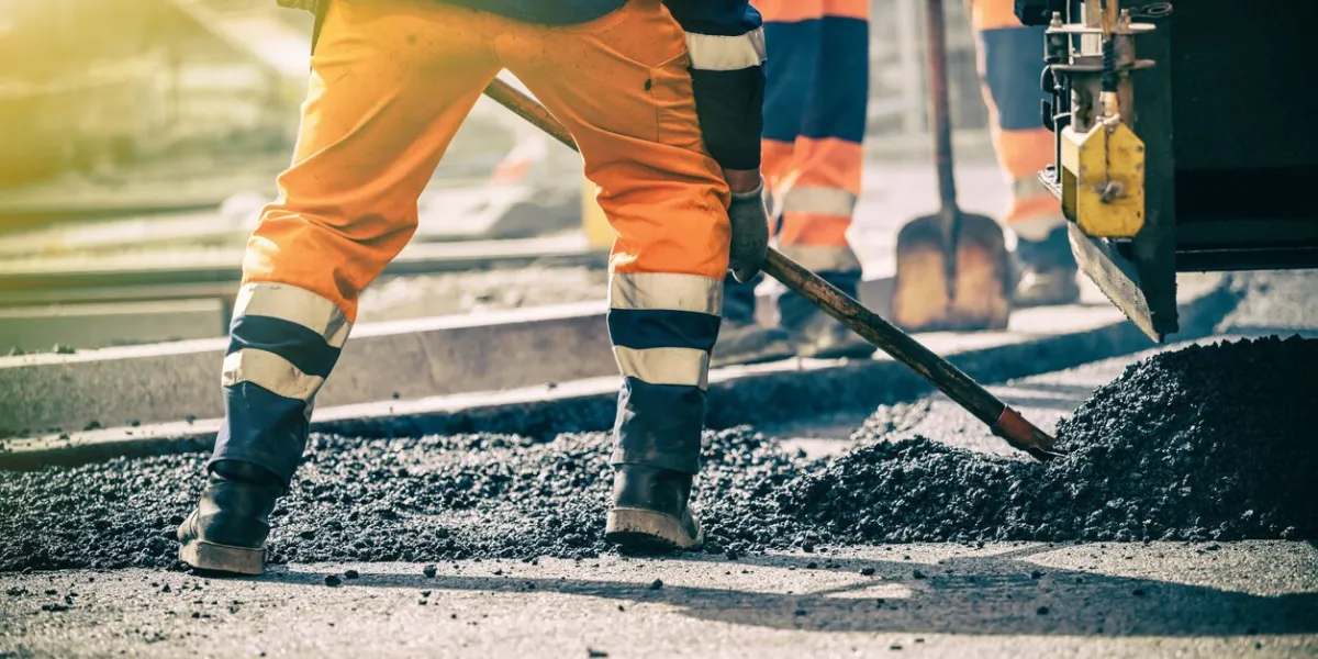 teamwork, group of workers on a road construction, team of people at work