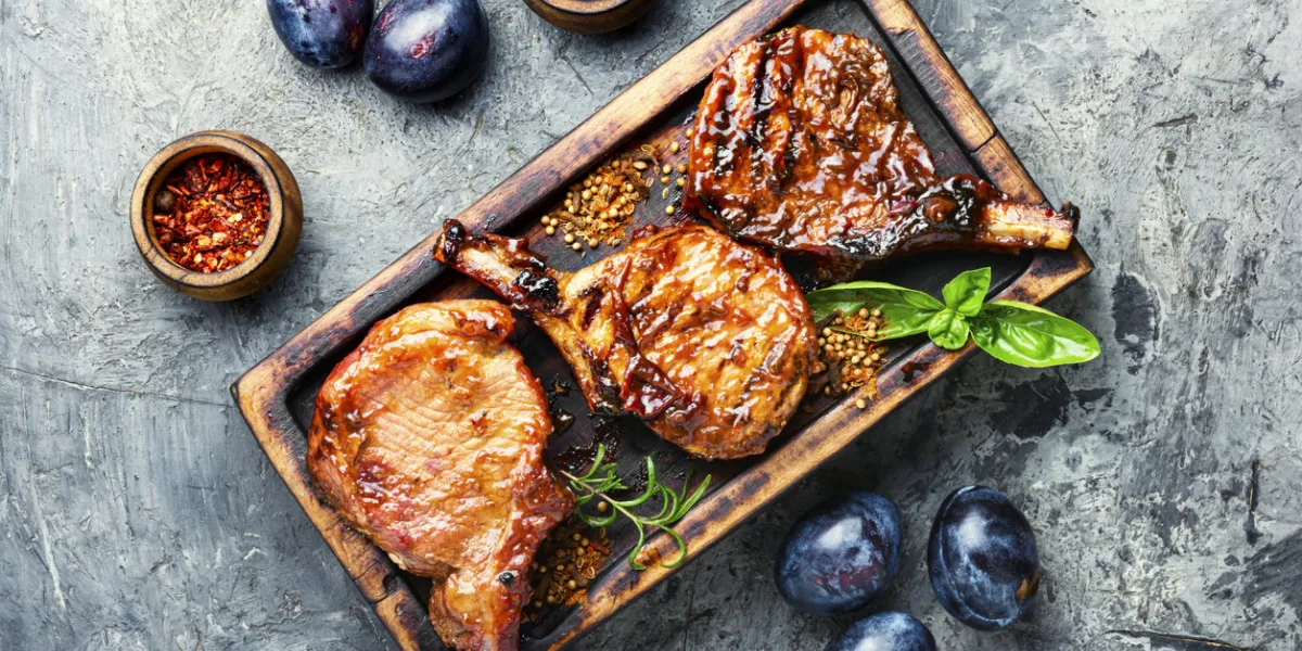 spicy meat grilled spare ribs on wooden cutting boardgrilled meat grilled meat with autumn plumbbq