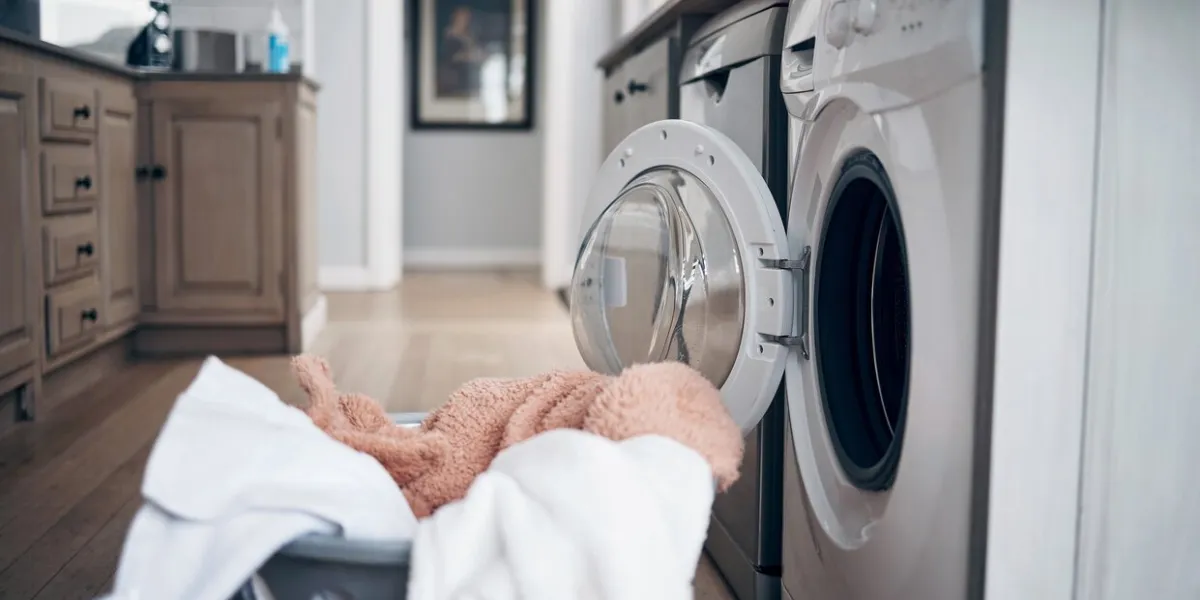 shot of a laundry basket filled with freshly dried clothes