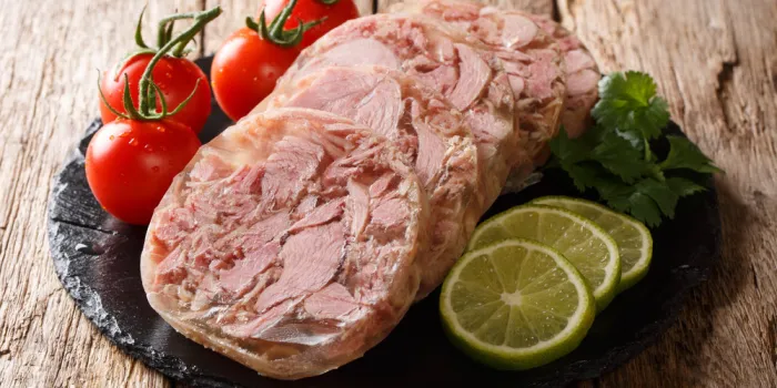 healthy tasty food head cheese or brawn and fresh tomatoes, lime