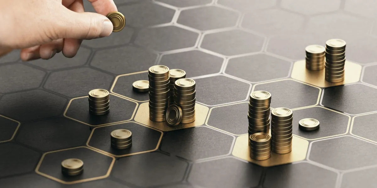 human hand stacking generic coins over a black background with hexagonal golden shapes concept of investment management and portfolio diversification composite image between a hand photography and a 3d background