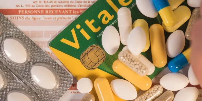 french carte vitale, social security card, with pills