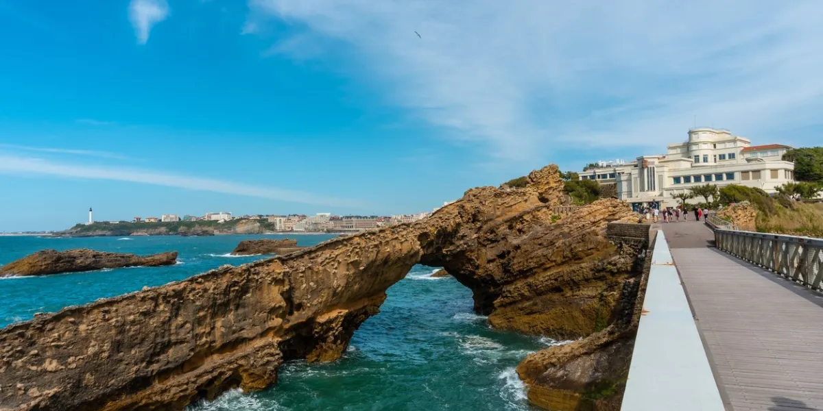 the beautiful plage du port vieux touristic beach with wooden bridge in biarritz municipality, france