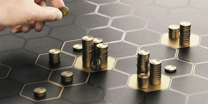 human hand stacking generic coins over a black background with hexagonal golden shapes concept of investment management and portfolio diversification composite image between a hand photography and a 3d background