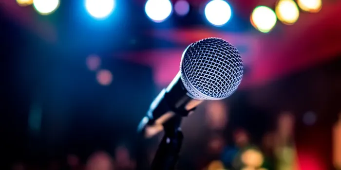 public performance on stage microphone on stage against a background of auditorium shallow depth of field public performance on stage
