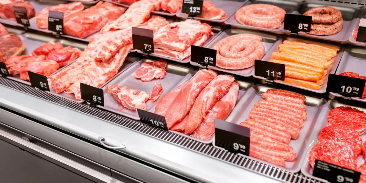 various sorts of meat on display in shop or supermarket