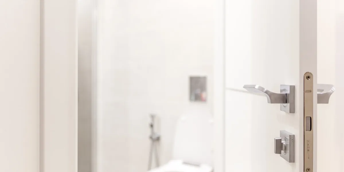 open door in bathroom with toilet