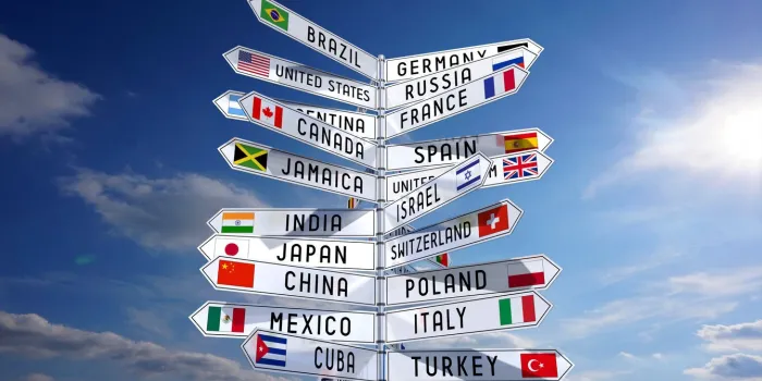 signpost with national flags of different countries, sky in background - 3d illustrationflag reference  wwwwikipediaorgmy own font face design and sky photograph