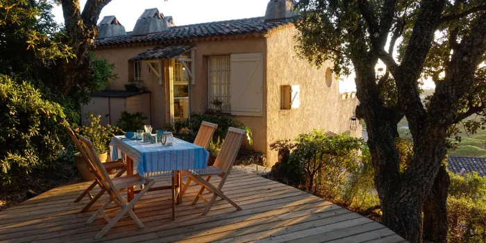 country house in the south of france in the evening light terrace with set table