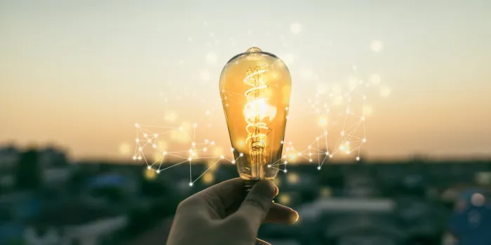 hand business man holding light bulb with light line alternative energy, idea, saving electricity innovation and inspiration concepts