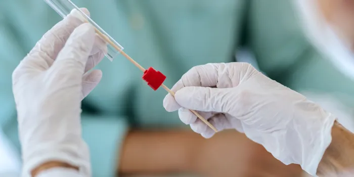 close-up of of healthcare worker testing a patient for coronavirus during pandemic