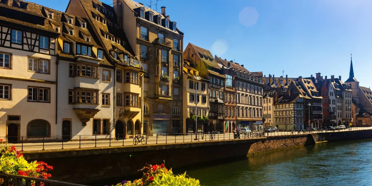 picturesque view of old french town of strasbourg with canals and ancient fachwerk houses at sunny summer day