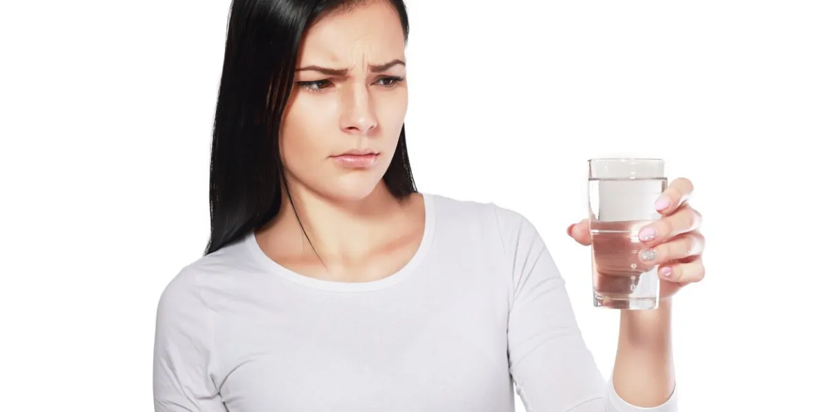 dangerous water young asian woman looking at water looking unhappy or disgusted