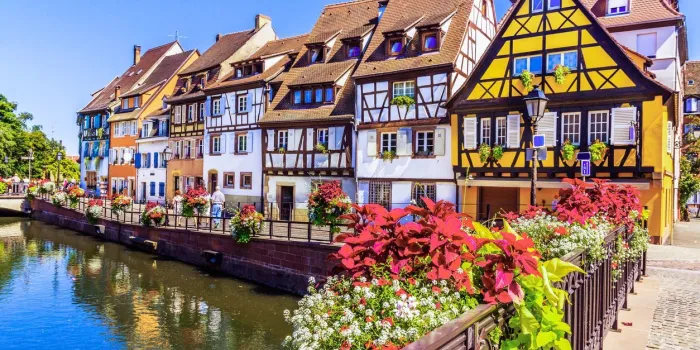 colmar, alsace, france petit venice, water canal and traditional half timbered houses