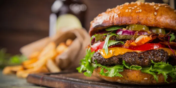 close-up of home made tasty burgers on wooden table