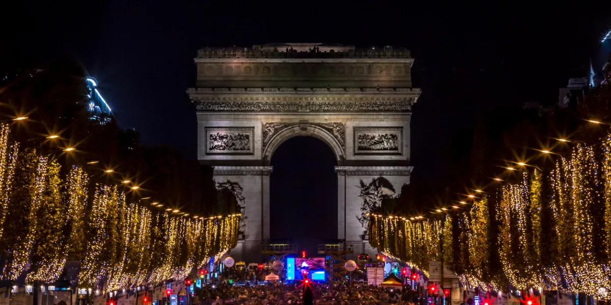 paris, france - november 20, 2022  christmas time, the decoration along the avenue des champs elysees with arc de triomphe in background in paris, france
