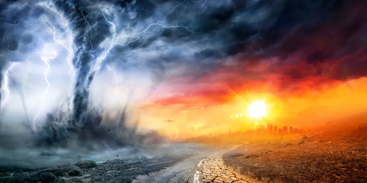 tornado in stormy landscape - climate change and natural disaster concept