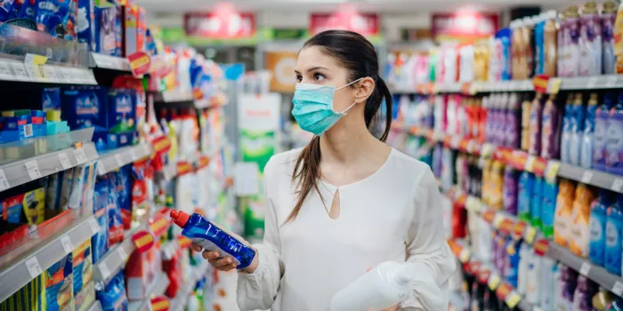 woman wearing protective mask preparing for virus pandemic spread quarantinehygiene, cleaning and disinfection productspreventive measures and protectionsupply shopping during the epidemic