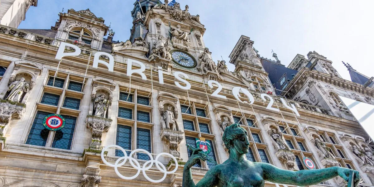 paris, france - march 4, 2024  facade of the town hall of paris, france, decorated for the olympic and paralympic games paris is the host city of the 2024 summer olympics
